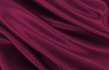 Smooth elegant pink silk or satin luxury cloth texture as abstract background. Luxurious valentines day background design