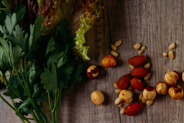 the concept of proper nutrition: nuts, greens - salad and parsley