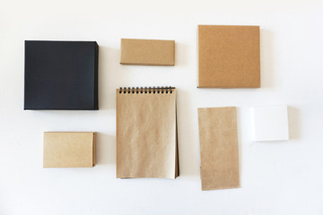 A set of office items made of black and craft paper. Top view.