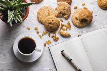 Working weekdays Diary Cookies Flower in a pot on a light background