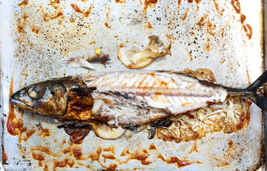 fried mackerel in sauce, stuffed with lemon