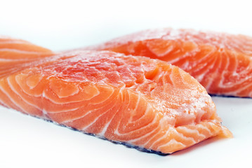 Slices of the fresh salmon on white