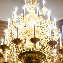 Big bronze chandelier in cathedral christian church