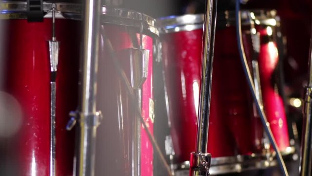 Close up of colorfull red tom tom drums.