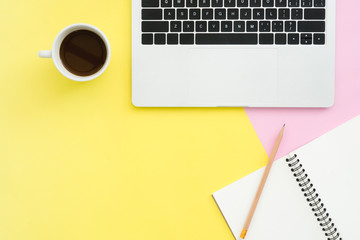 Minimal work space - Creative flat lay photo of workspace desk. Top view office desk with laptop, notebooks and coffee cup on pastel color background. Top view with copy space, flat lay photography.