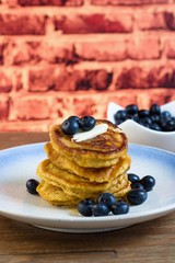 Pancakes with syrup and  blueberries