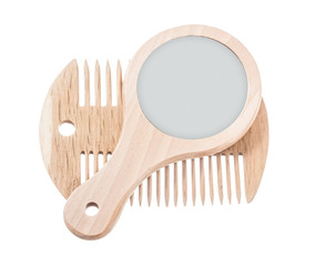 Composition of wooden comb mirror isolated on white