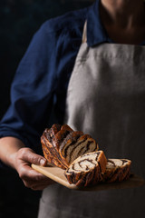  Woman holding homemade poppy seed cake