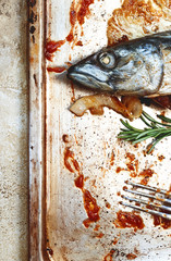 fried mackerel in sauce, stuffed with lemon
