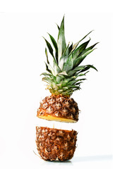 Fresh juicy pineaplle flying on white background