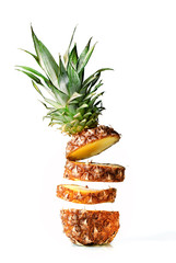 Fresh juicy pineaplle flying on white background