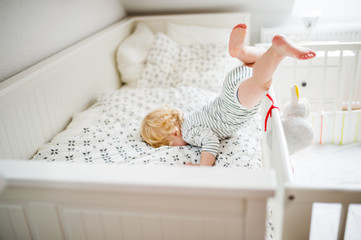 Toddler boy in a dangerous situation at home.