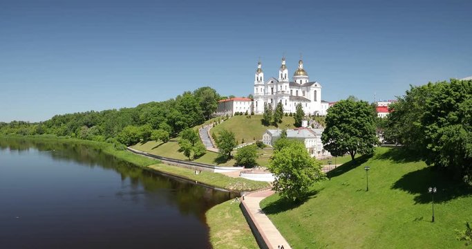 Vitebsk, Belarus. Assumption Cathedral Church In Upper Town On Uspensky Mount Hill And Dvina River In Summer Evening Sunset Time. Zoom, Zoom Out