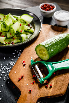 Fresh cucumber on cutting board