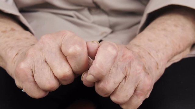 Hands of the elderly. Bad news to the elderly