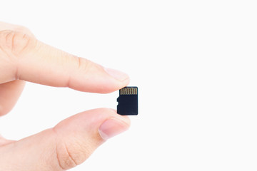 Small Flash card in hand isolated on white background.