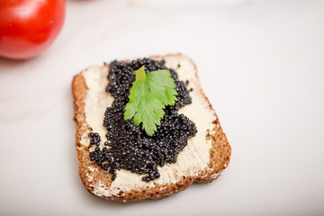 Black caviar on a slice of bread