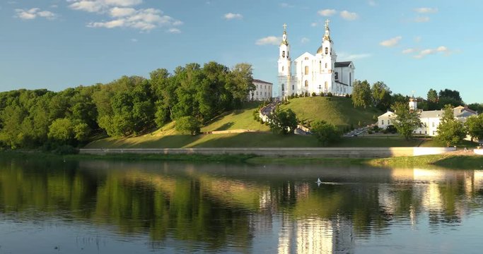 Vitebsk, Belarus. Assumption Cathedral Church, Town Hall, Church Of Resurrection Of Christ And Dvina River In Sunny Summer Day. Pan, Panorama