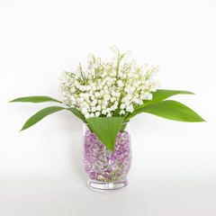 Nice bouquet of lilies of the valley for Mother's Day isolated on white background