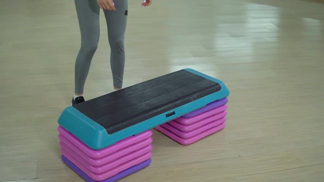Young sporty woman exercising in the gym. Cardio training.