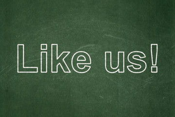 Social media concept: text Like us! on Green chalkboard background