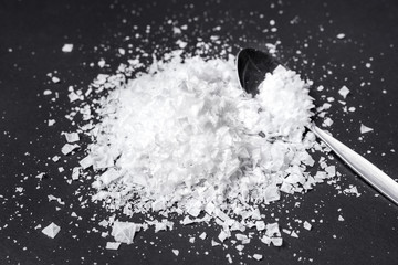 Sea flake salt isolated on black background