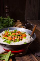 wok pan with meat strips and vegetables