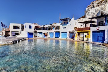 View of boat houses in Firopotamos fishing village on Milos island in Greece