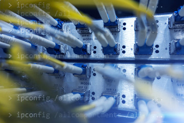 Fiber Optic SFP BNC Frame. Close up fiber optic in server room , network cables installed in the rack.  Yellow optical network cables. Audio large data center. 