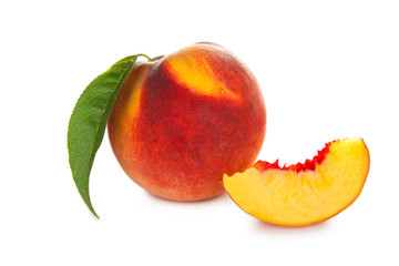 Peach fruits with leaf isolated on white background