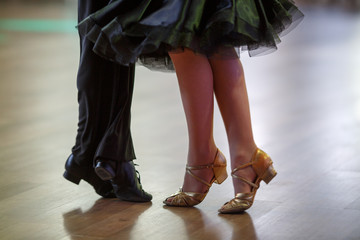 Closeup of dancer's legs as they do the ballroom dance - obrazy, fototapety, plakaty