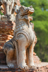 Fototapeta premium Lion guardian, decoration at Daw Cyan Pagoda Complex in ancient city Inwa (Ava) Mandalay, Myanmar