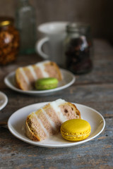 biscuit cake with white cream and macaroons