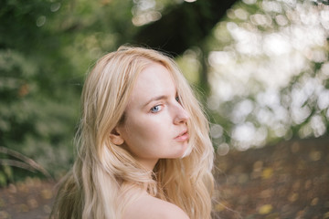 portrait of beautiful blonde girlfriends nature