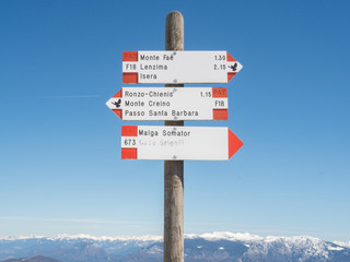 trekking on monte biaena Trentino with lot of snow in the wood