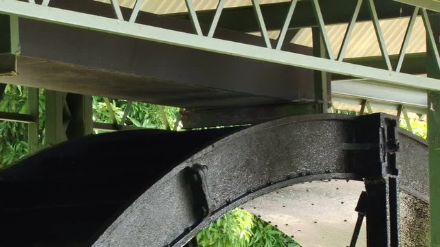 Close up shot of old water wheel at Depaz distillery on Martinique island