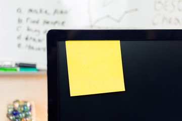 office messages concept, reminder blank yellow sticker on the monitor, mockup