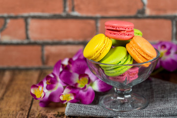 Macaron with beautiful colors are placed on the table.