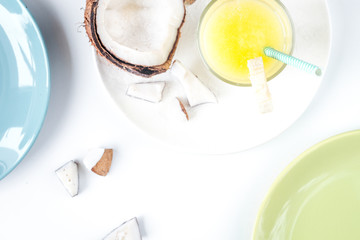 cocktail with coconut on white background top view