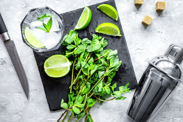 making mojito on stone background top view