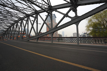 Fototapeta na wymiar Empty road floor surface with ironbridge