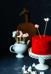 Close-up of red velvet cake with marshmallow on grey table