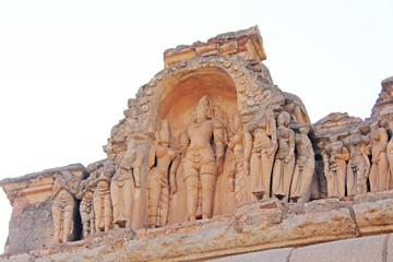 Stone bas-reliefs on the walls in Temples Hampi. Carving stone ancient background. Carved figures...