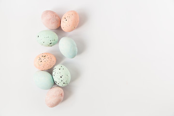 Colored Easter pastel marbled eggs.Minimalistic style.Flat lay.Copy space.White background.
