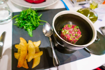 French fries and food preparation on chopping board, Athens, Greece