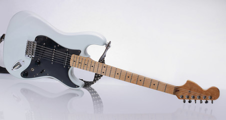 closeup.stylish guitar with reflection. isolated on a white