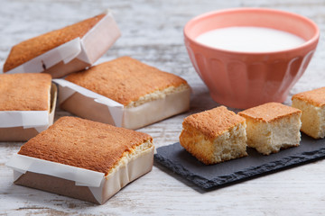 Sobaos pasiegos on an old wooden table