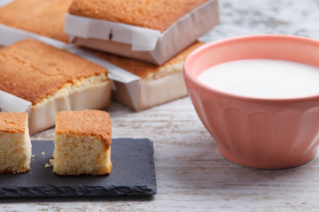 Sobaos pasiegos on an old wooden table