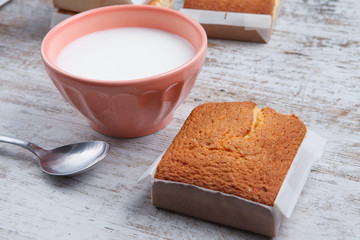 Sobaos pasiegos on an old wooden table