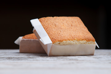 Sobaos pasiegos on an old wooden table